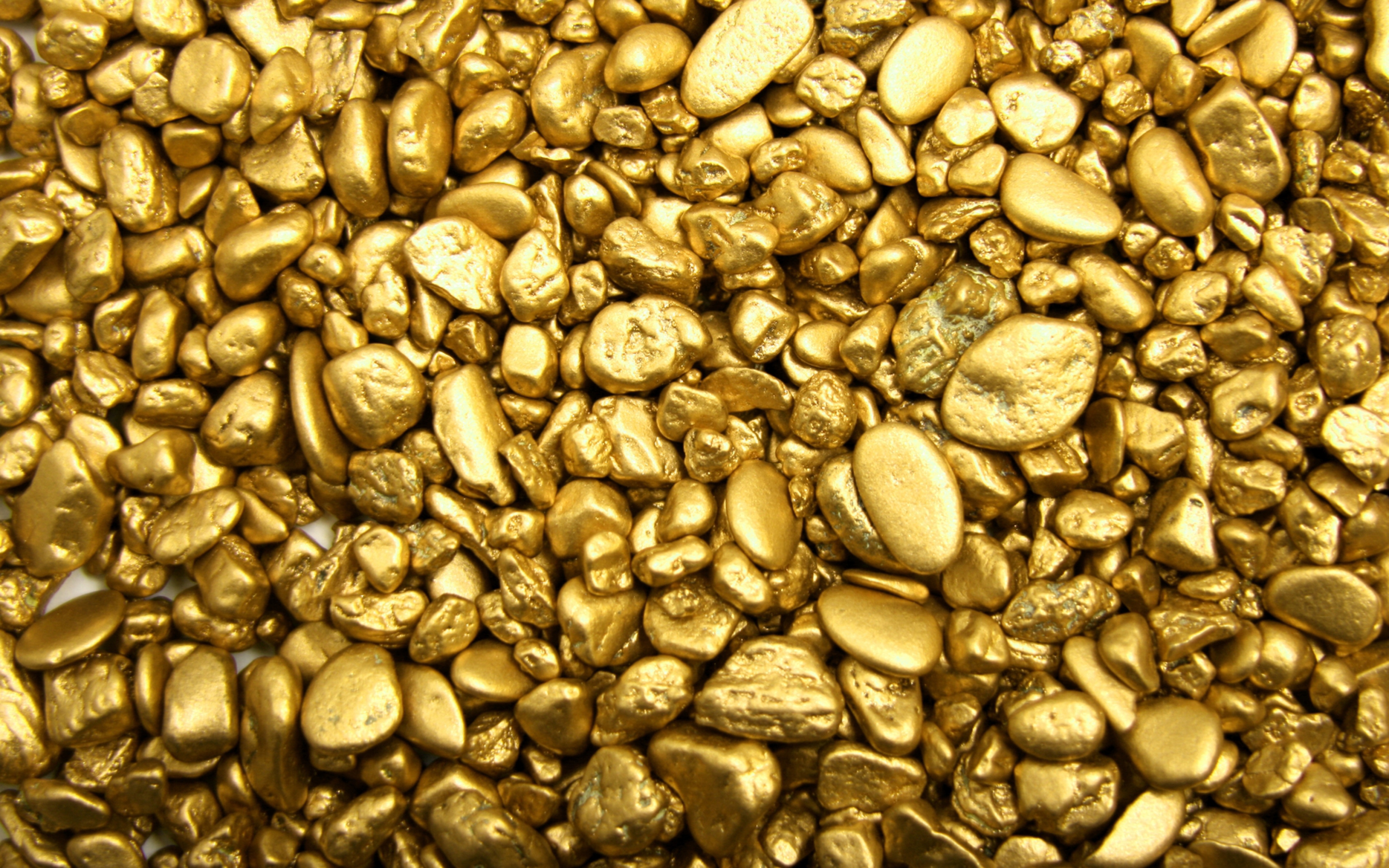 Gold stone. Золото. Золото камушки. Золото россыпью. Текстура золотого металла.